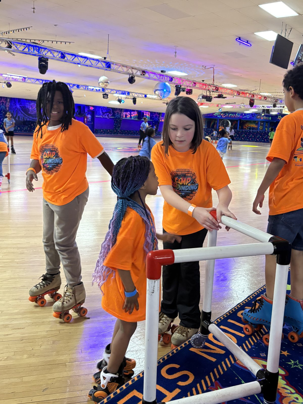 Camp Astounding scholars on a summer field trip at the roller skating rink