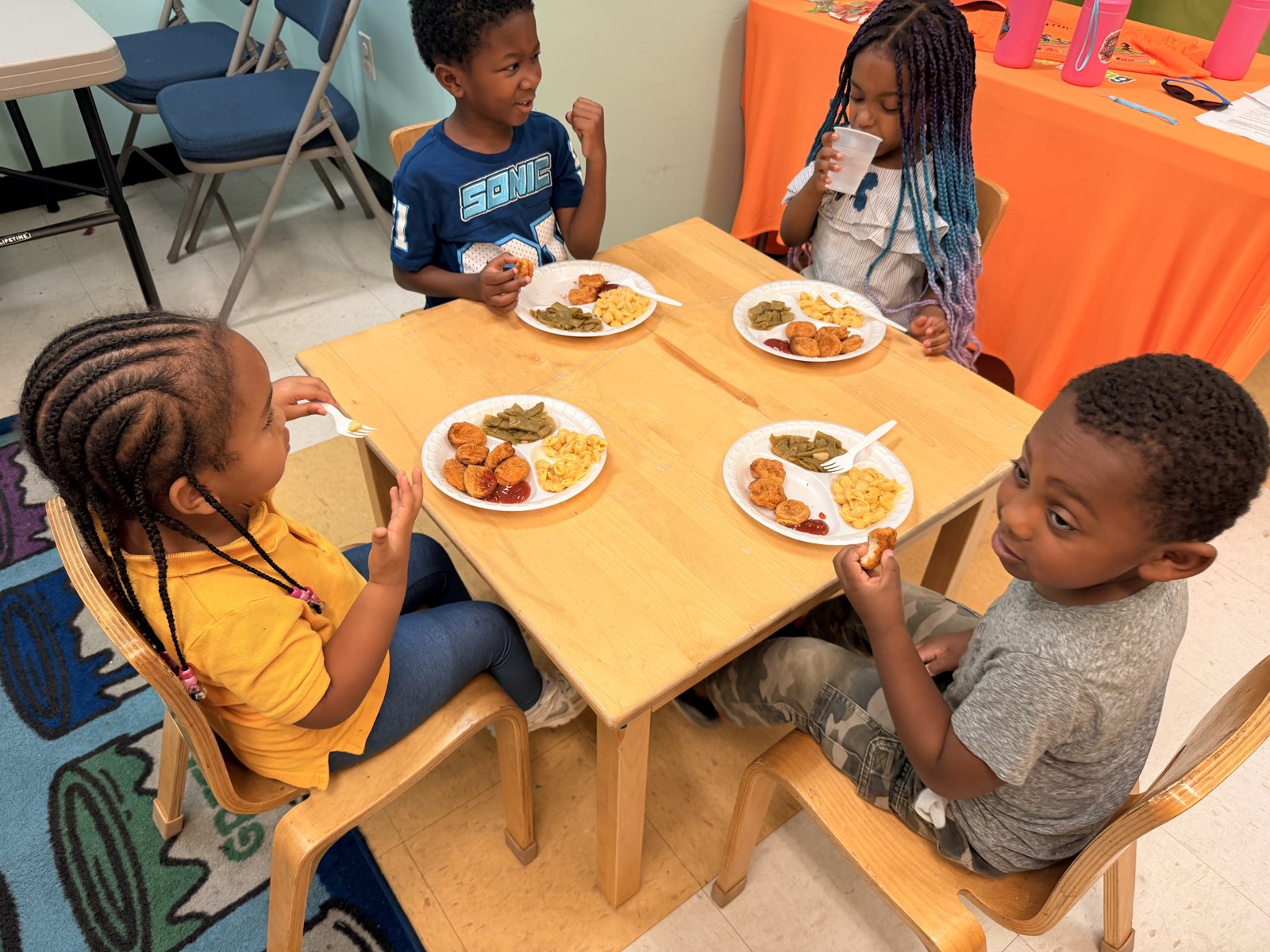 Scholars enjoying a hot lunch together